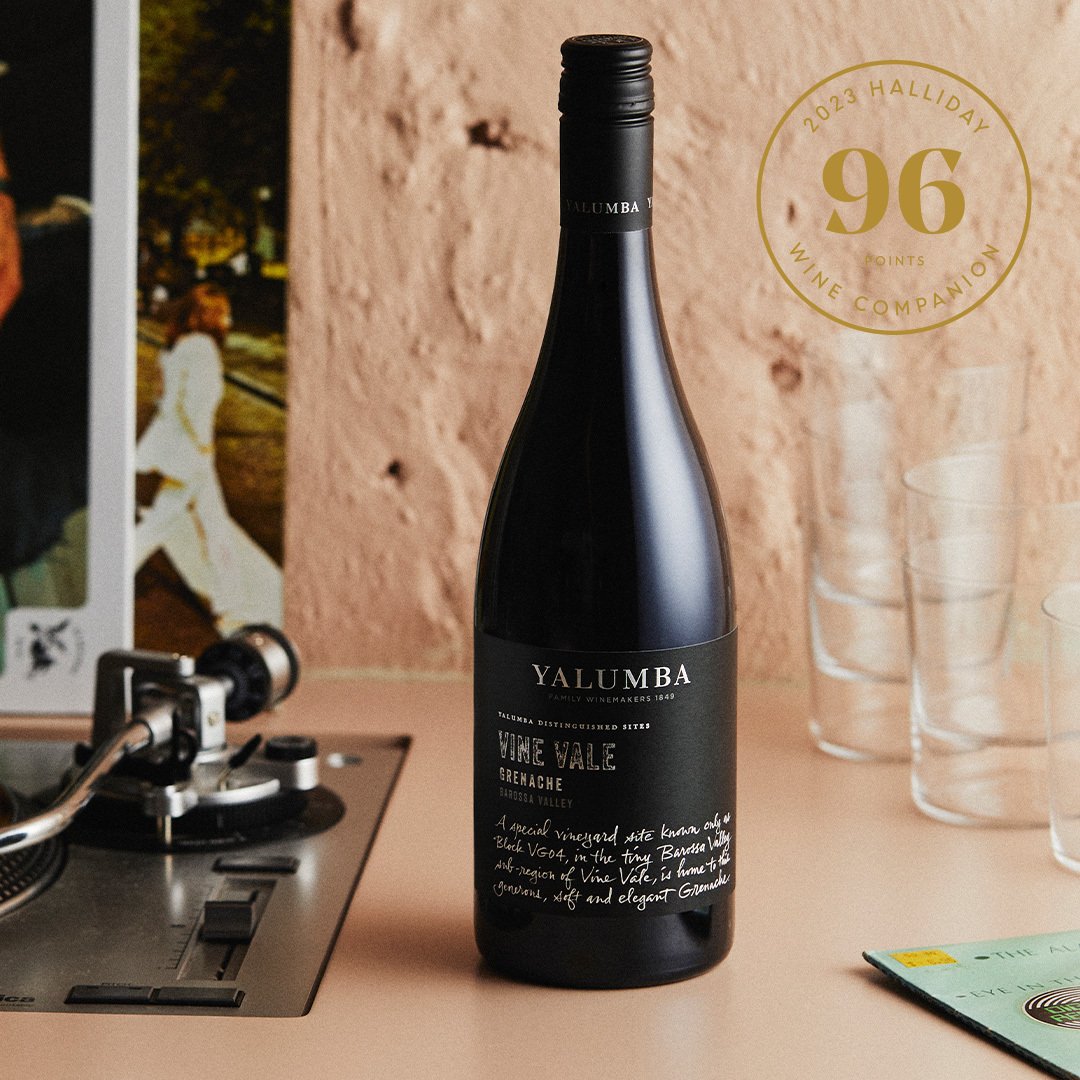 Vine Vale Grenache bottle next to vinyl record player with Halliday 96 points award