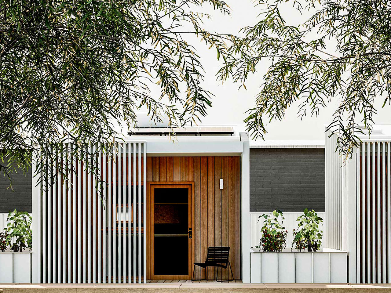 Forage Built Calyx tiny home with wooden and metal exterior and surrounding greenery